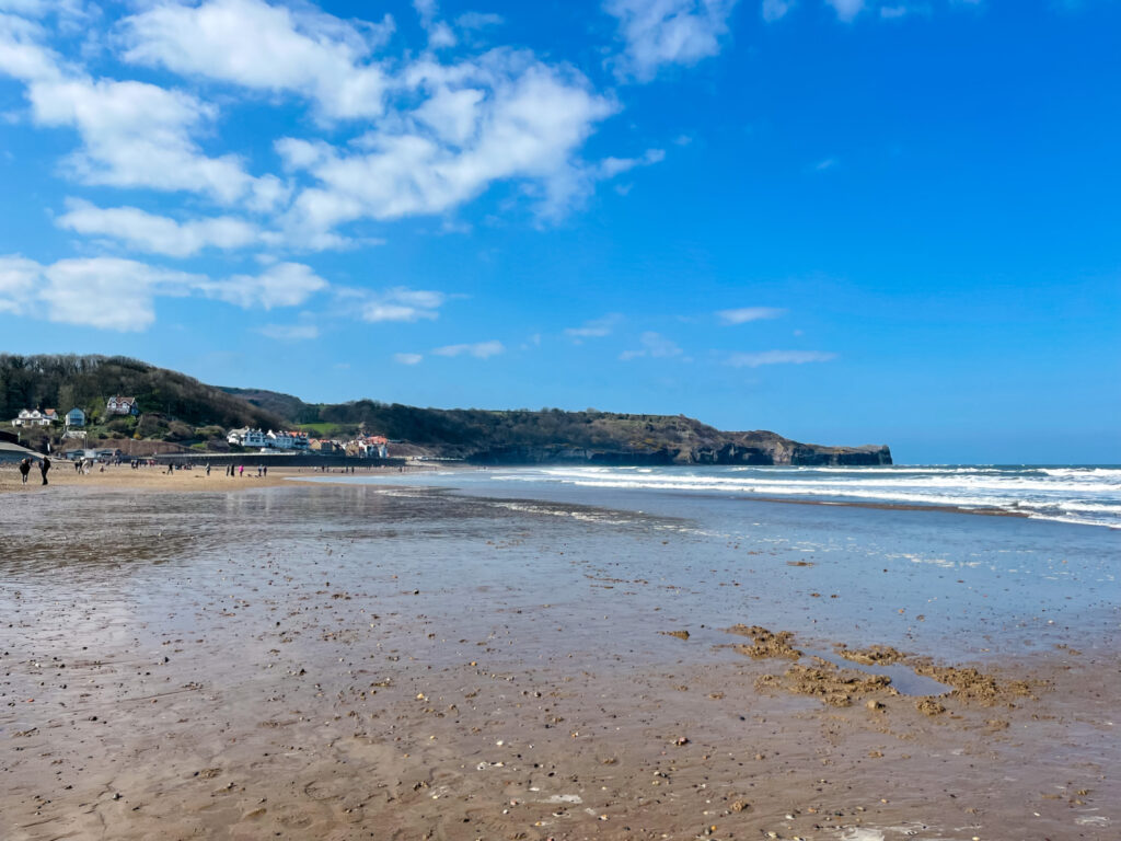 sandsend beach in whitby, with cliffs in distance